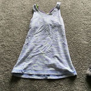Cross back tank top with built in bra liner. no pads